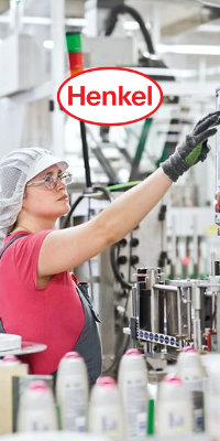An assembly-line worker examining products with the Henkel logo overlayed.
