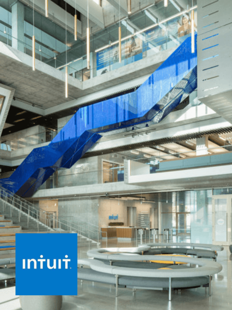 A high-tech office lobby with the Intuit logo overlayed.