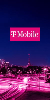 A deep purple sky with bright pink city lights and the T-Mobile logo overlayed.